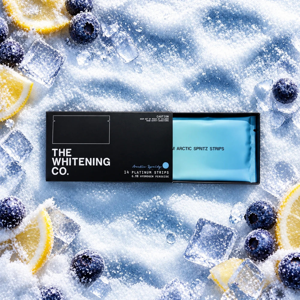 Platinum Strips Arctic Spritz on snow with blueberries, lemon and ice