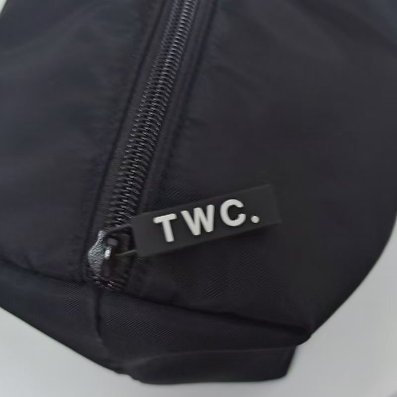 Rubber TWC. zip pull on the Onyx Beauty Bag